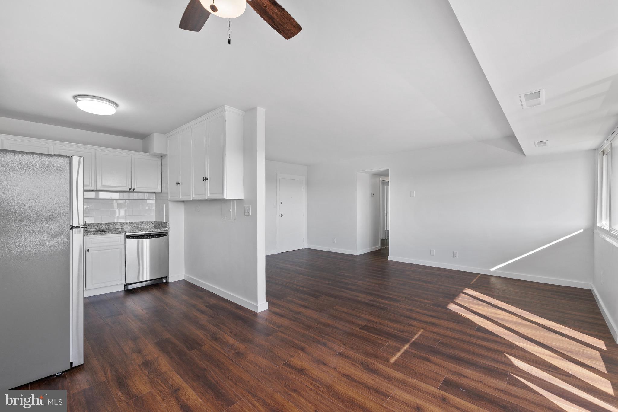 a view of kitchen and wooden floor