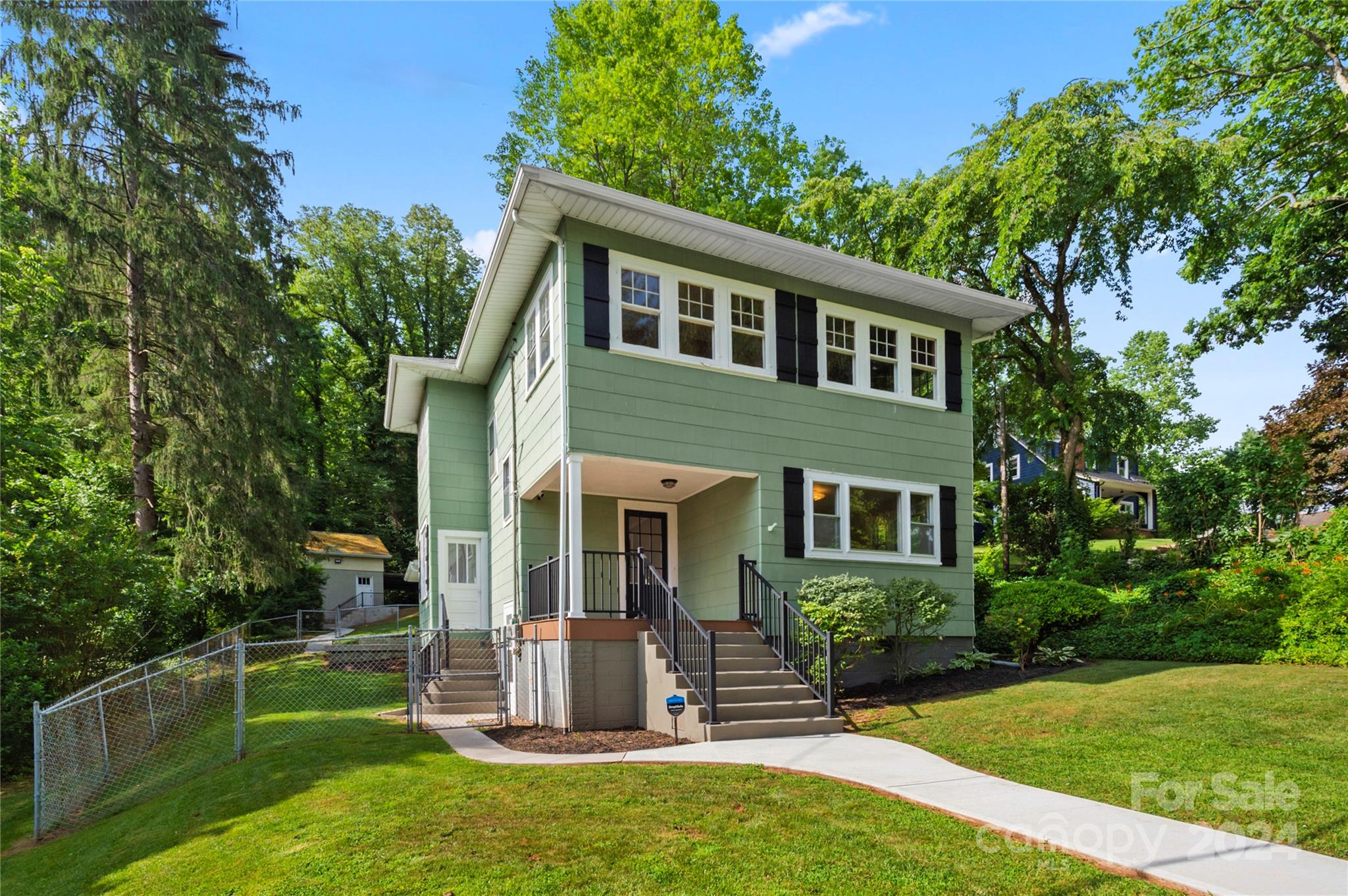 front view of a house with a yard