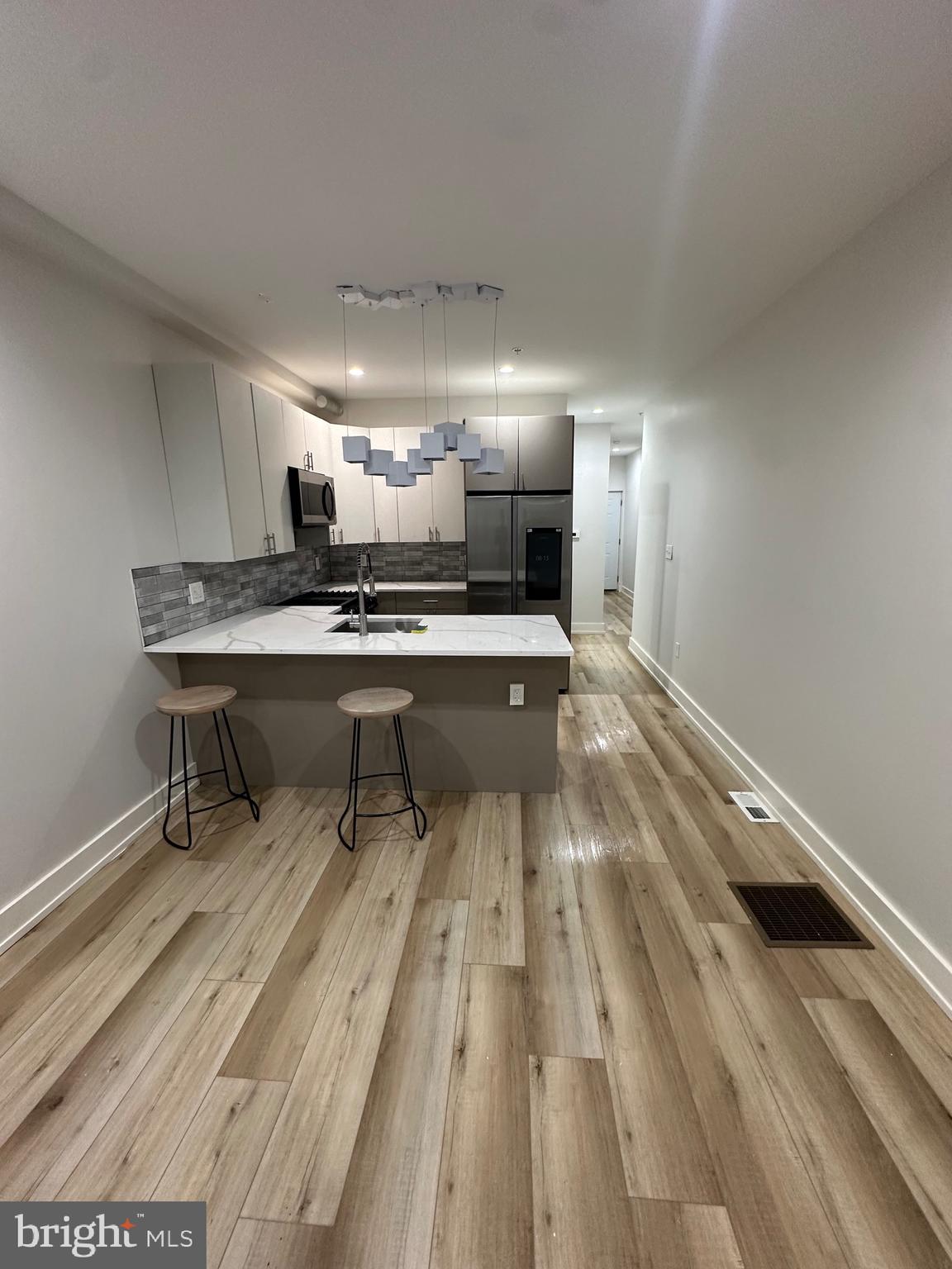 a room with wooden floor table tennis table