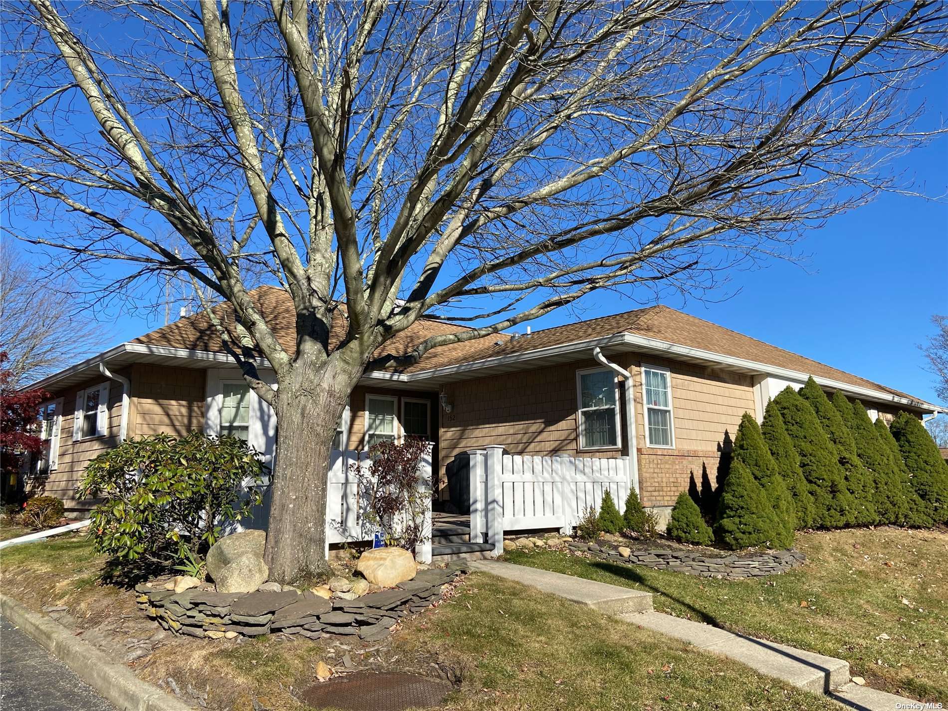 Front with new fence and patio