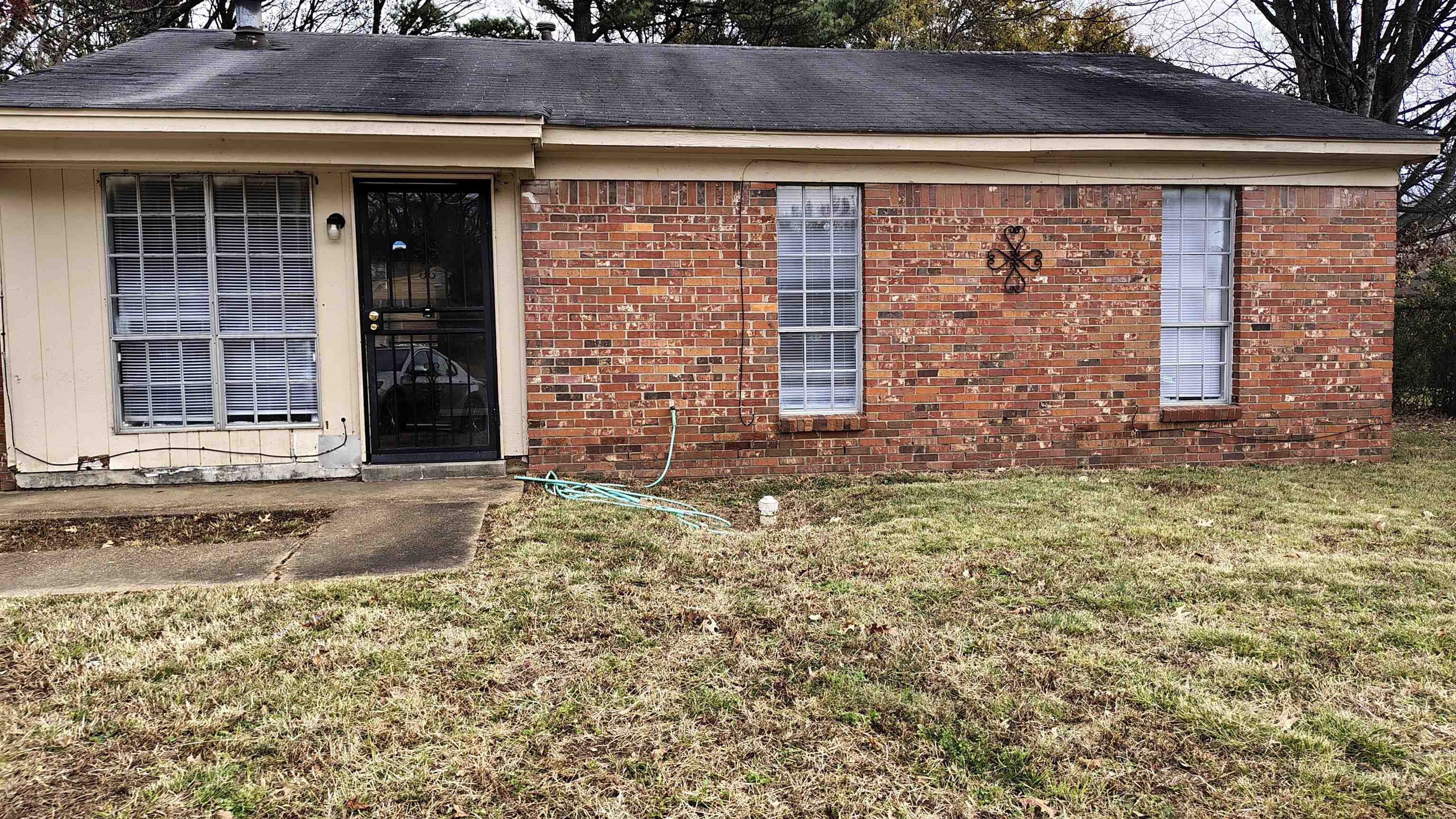 Exterior space featuring a yard