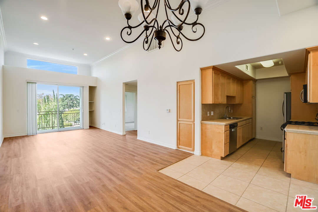 a kitchen with a refrigerator and a sink