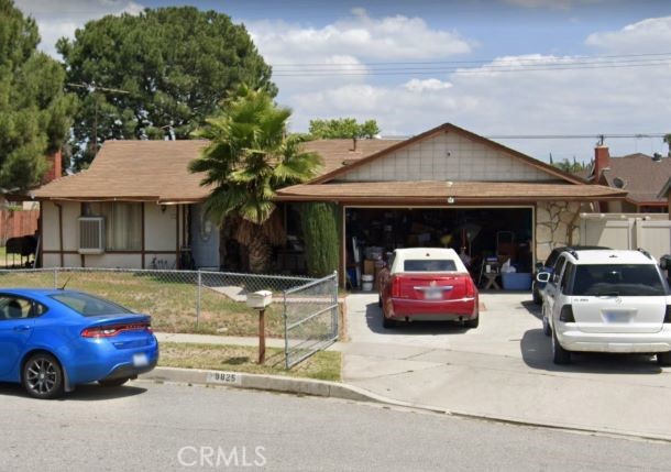 a front view of a house with parking space