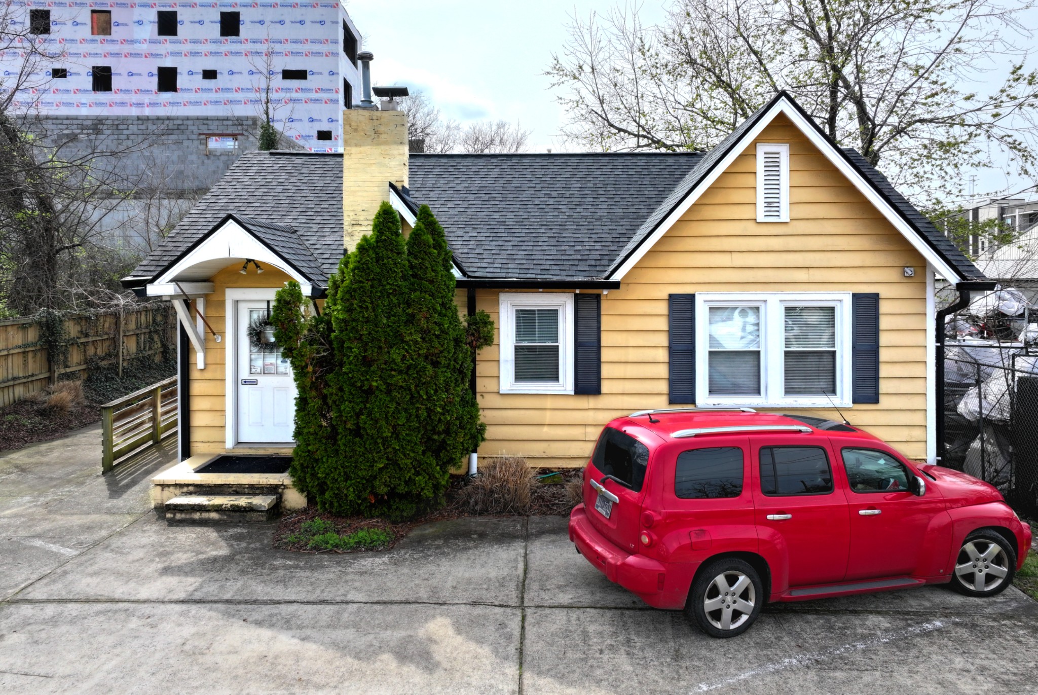 a front view of a house with parking space