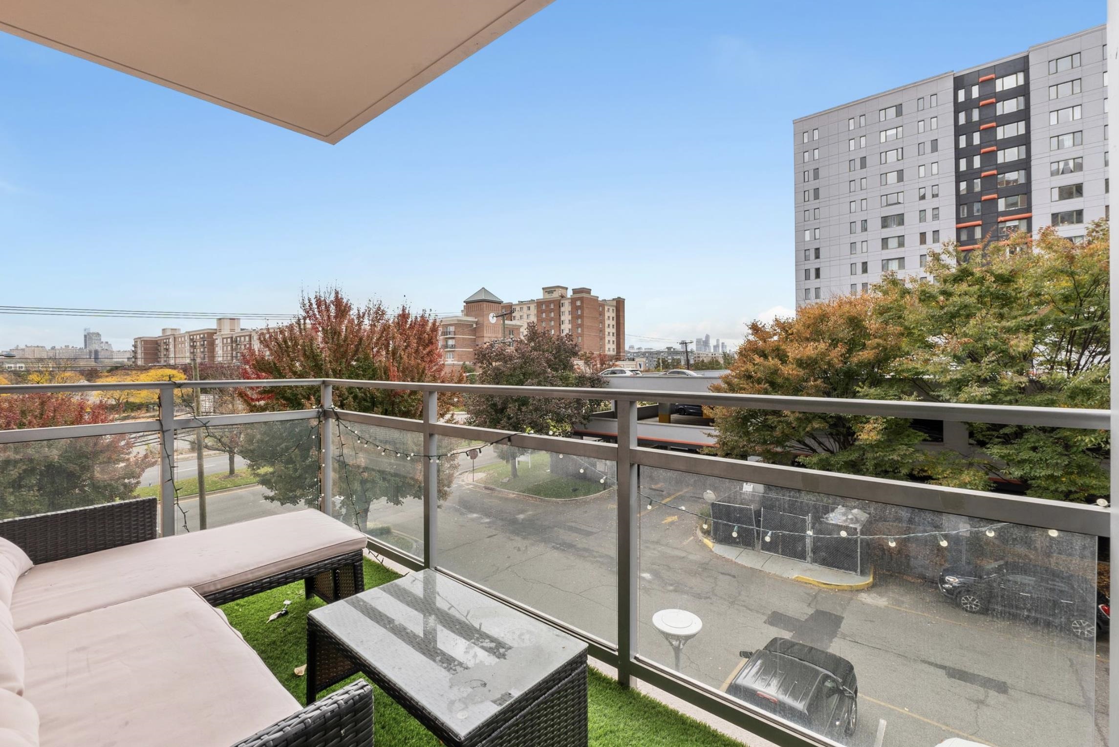 a view of a balcony with two chairs