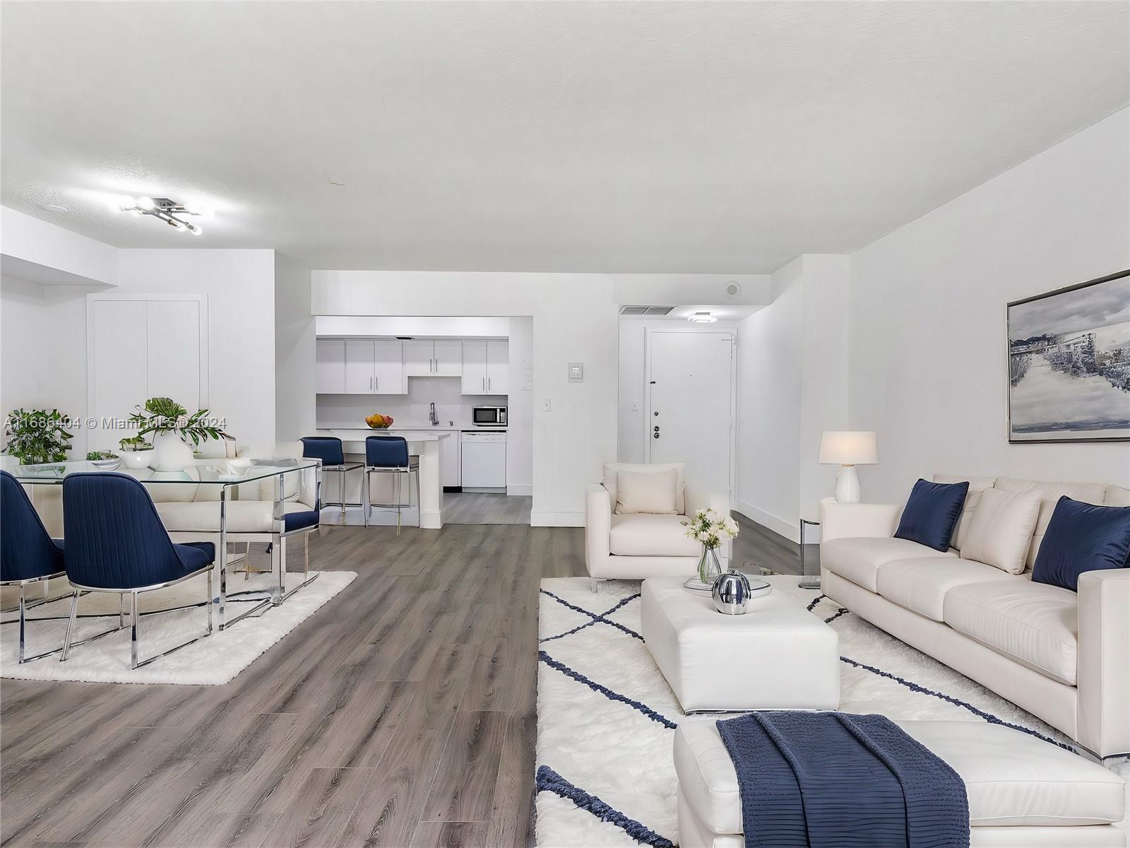 a living room with furniture or couch and a view of kitchen