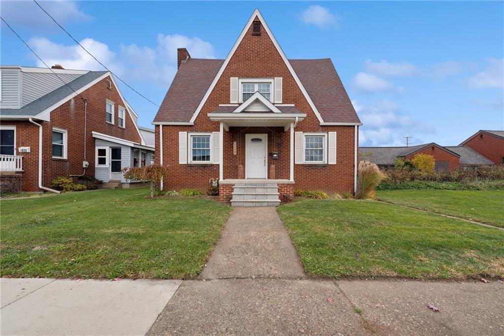 front view of a house and a yard