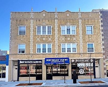 a view of a building with a street