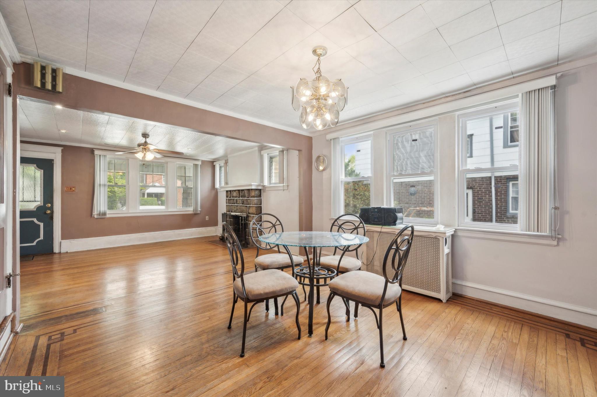 a view of a dining room with furniture wooden floor and chandelier