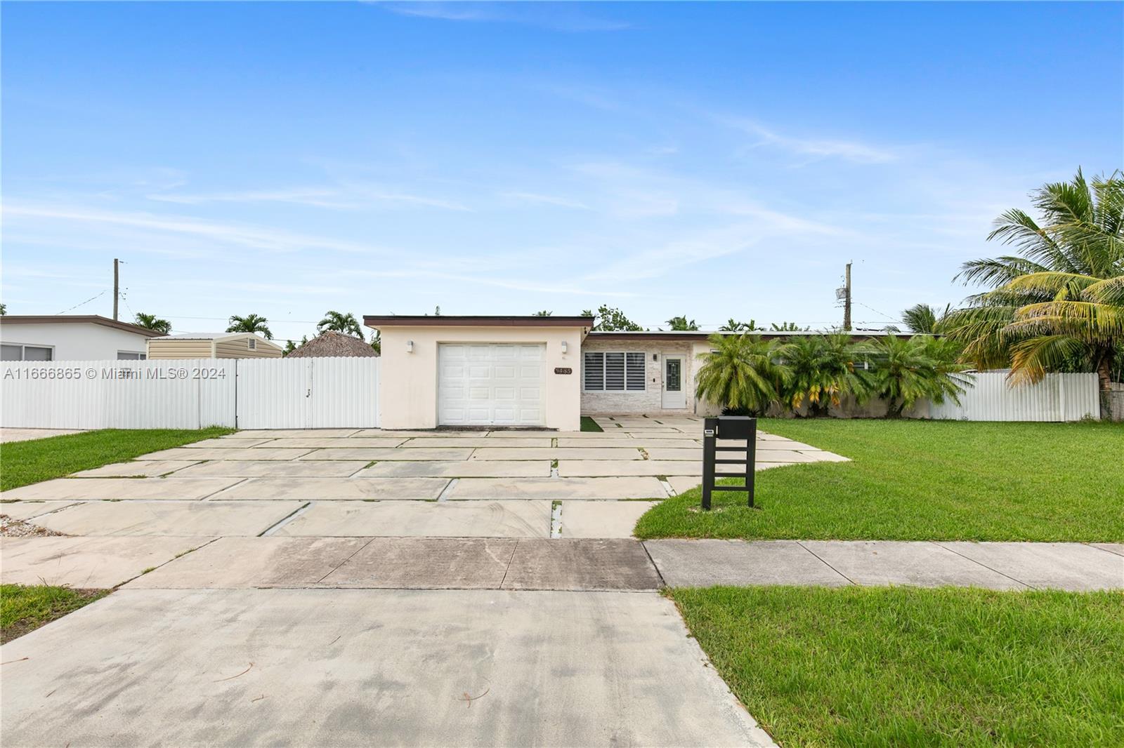 a view of a backyard of the house