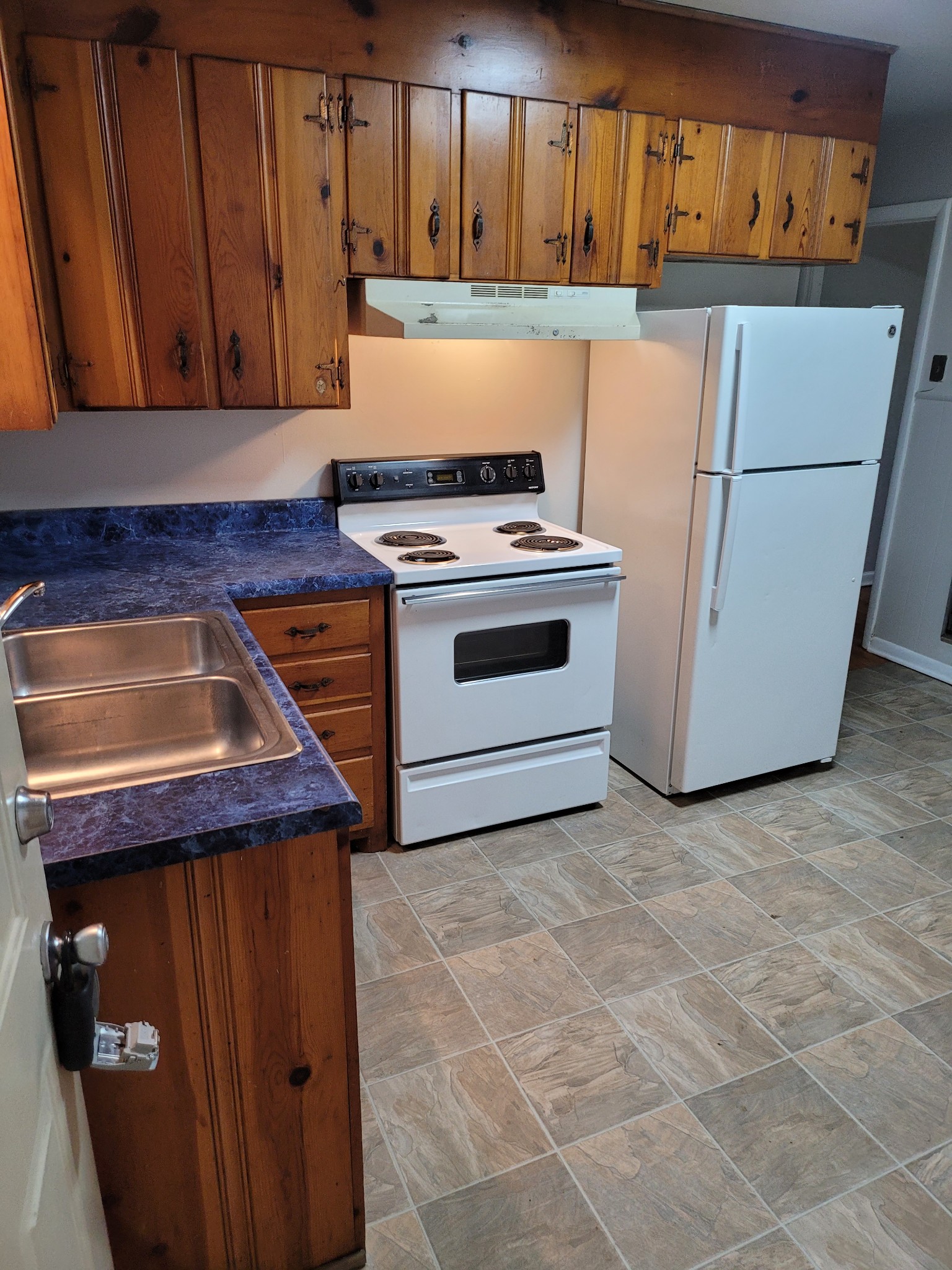 a kitchen with a stove and a microwave