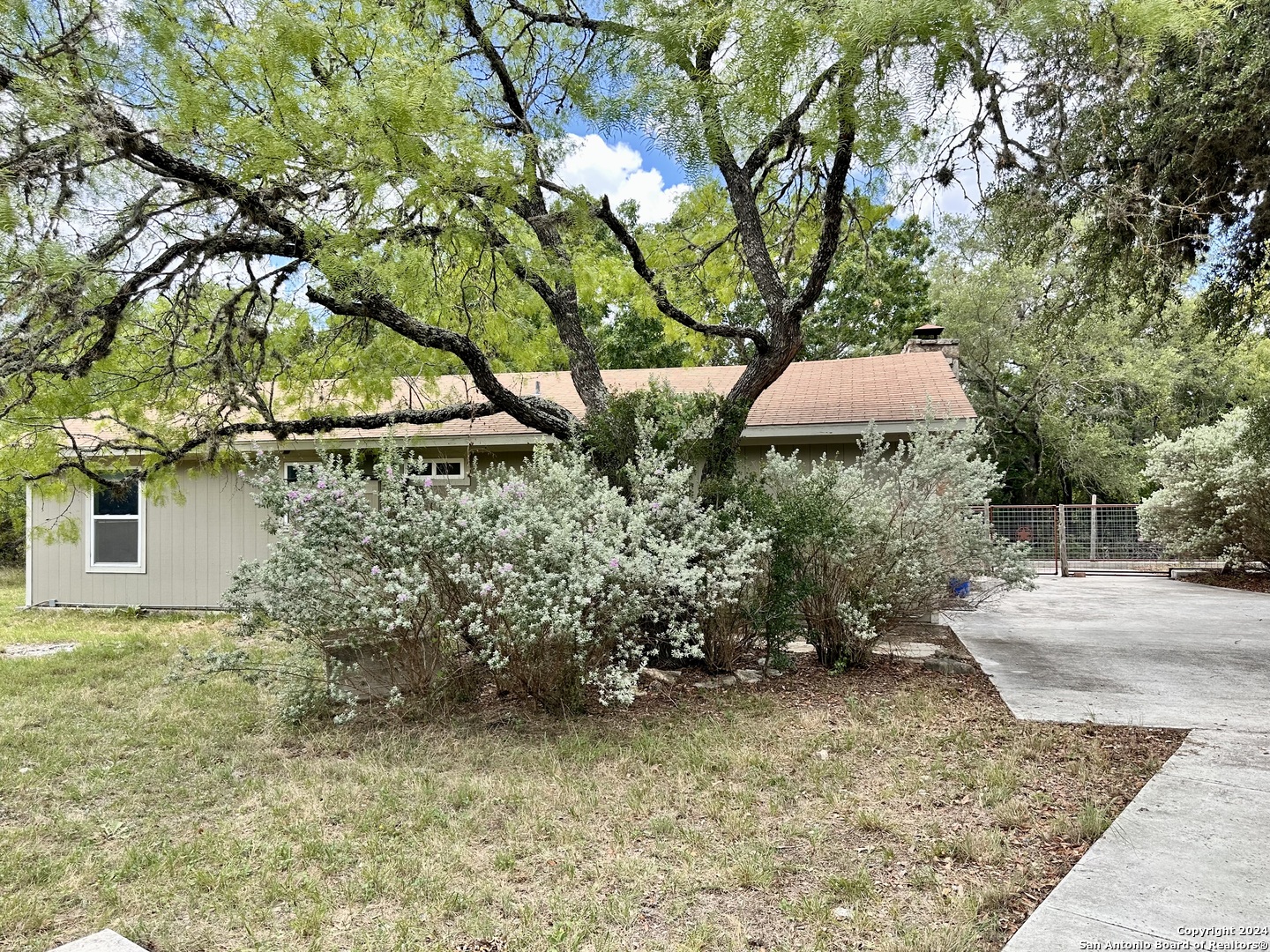 a backyard of a house with lots of green space