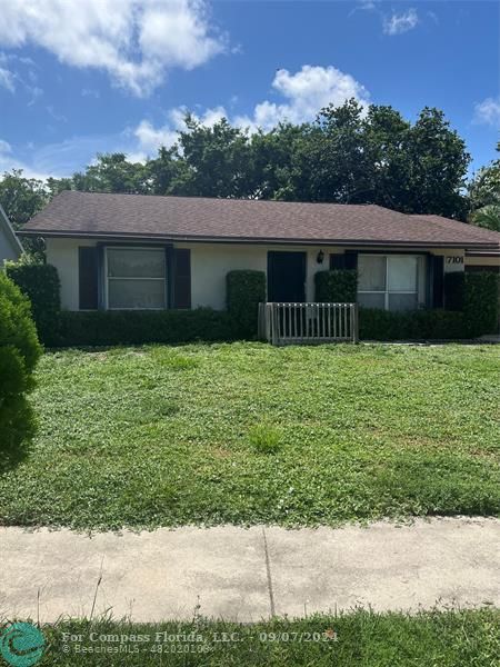 front view of a house with a yard