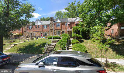 a view of multiple houses with a yard