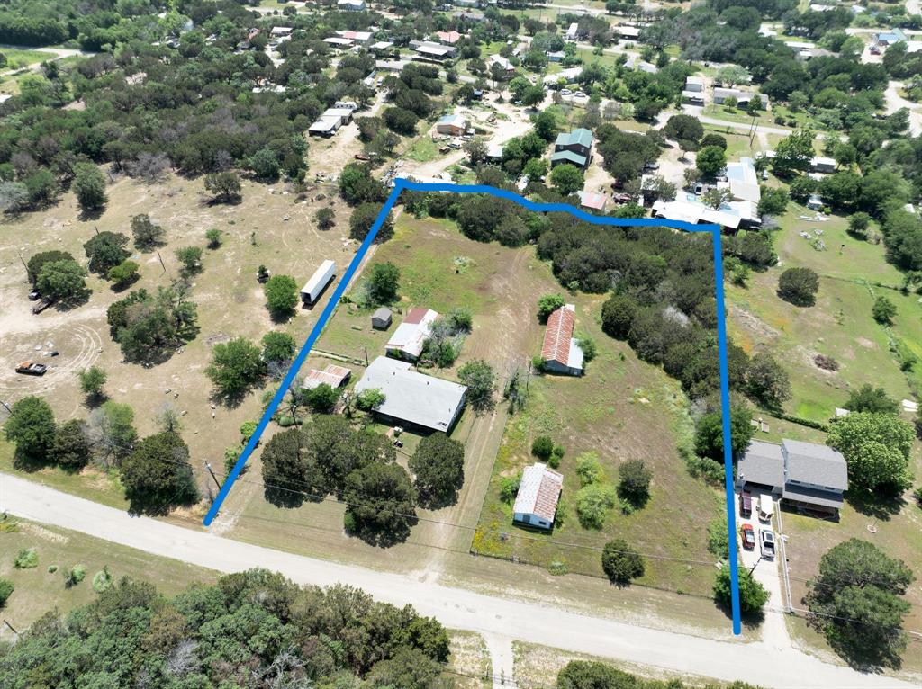 an aerial view of house with yard