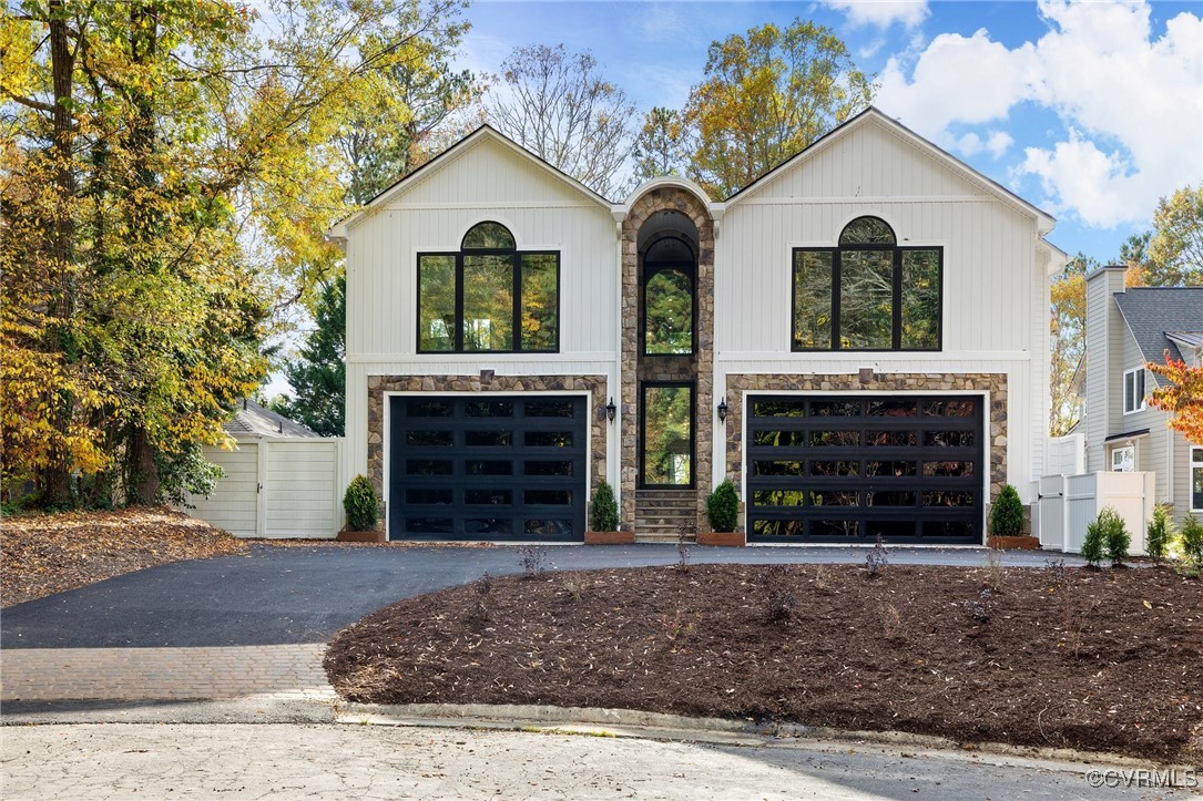 View of front of house featuring 2 2-car garges.