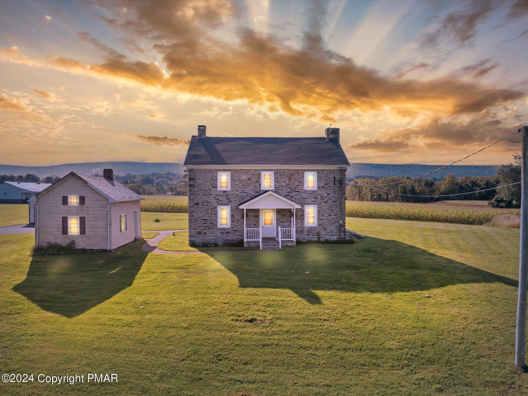 a view of a big house with a yard