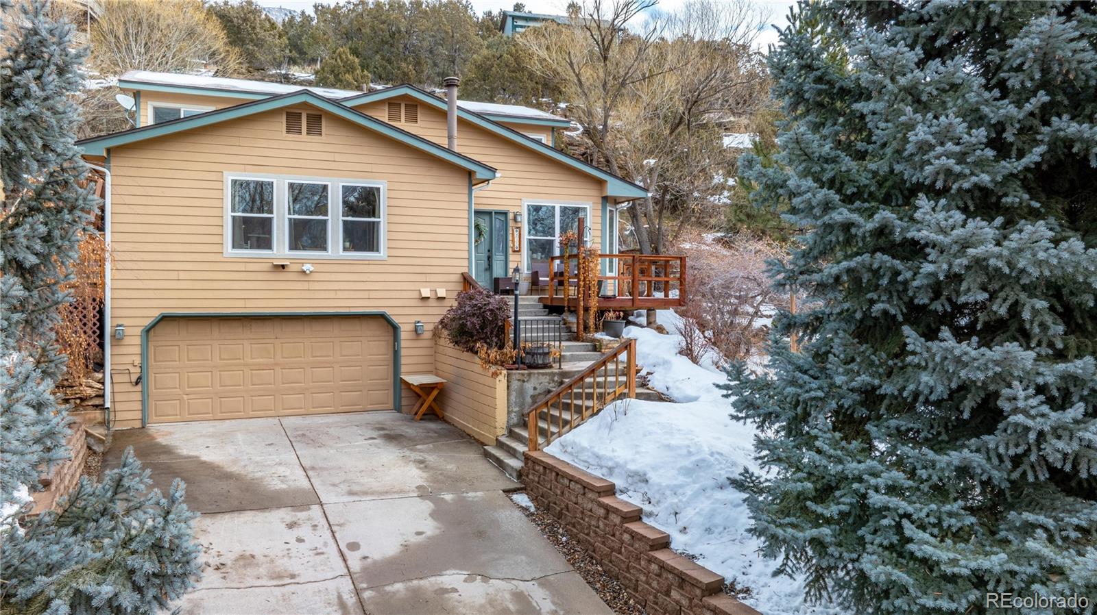 a view of a house with backyard and sitting area