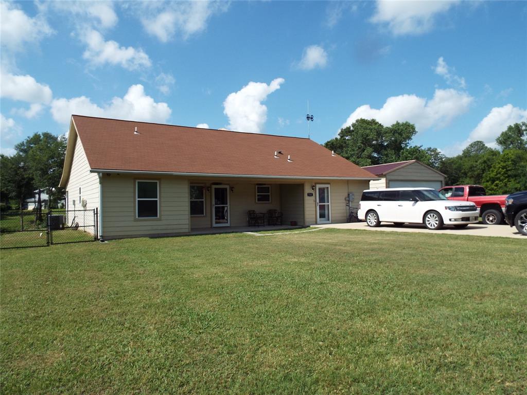 a front view of a house with a garden and porch