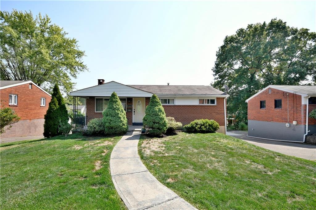 front view of a house with a yard