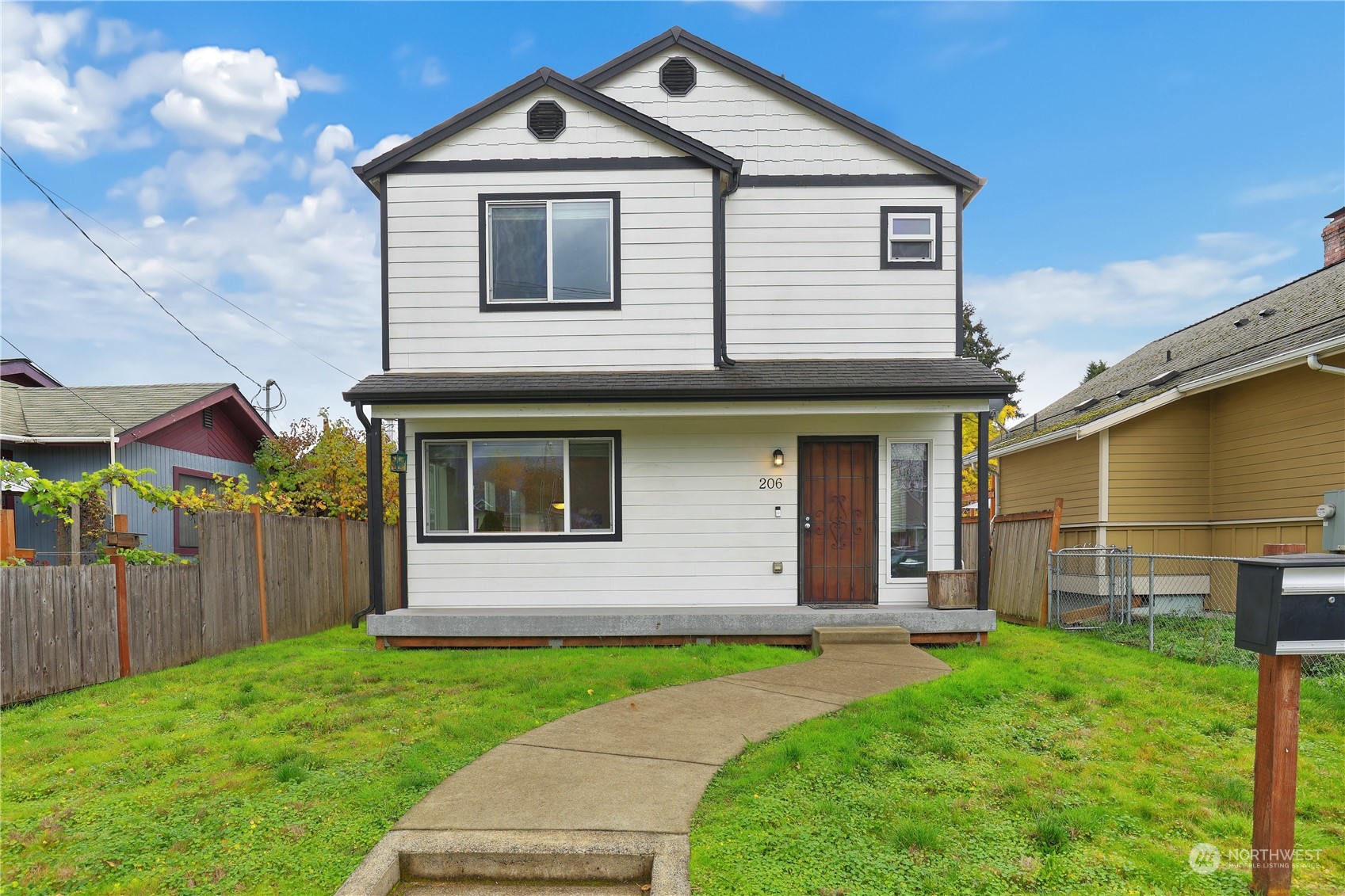 a front view of a house with a yard