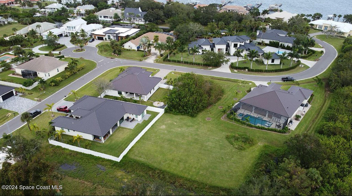 an aerial view of a house with a garden