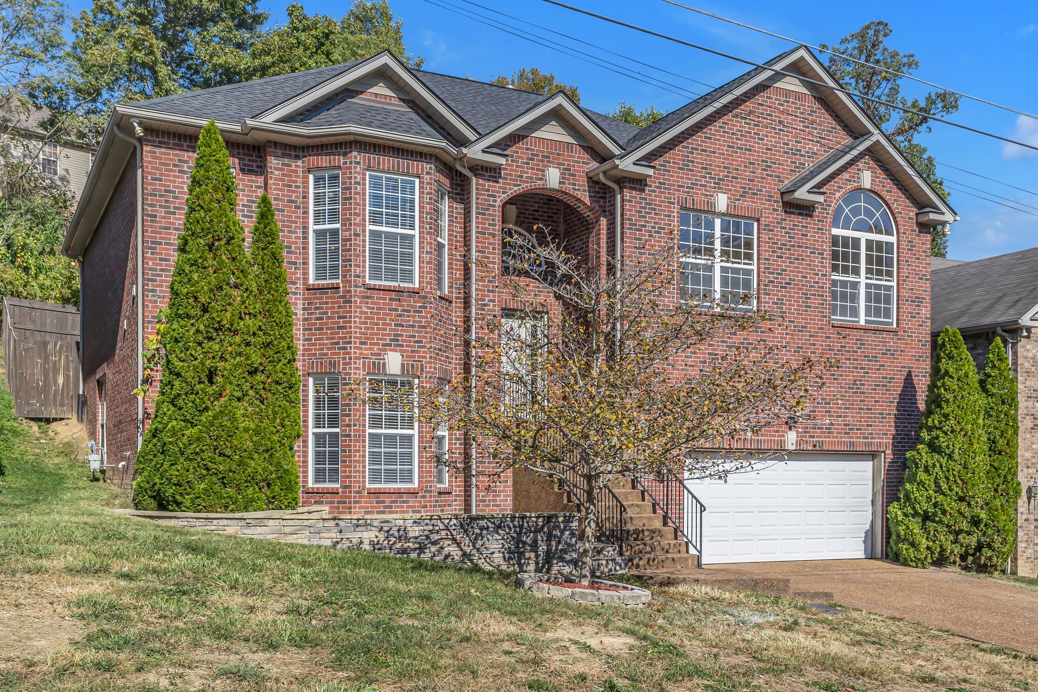 a front view of a house with a yard