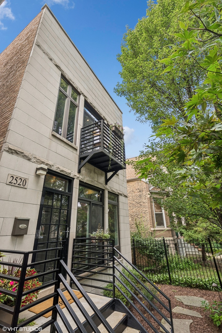 a view of a house with brick walls