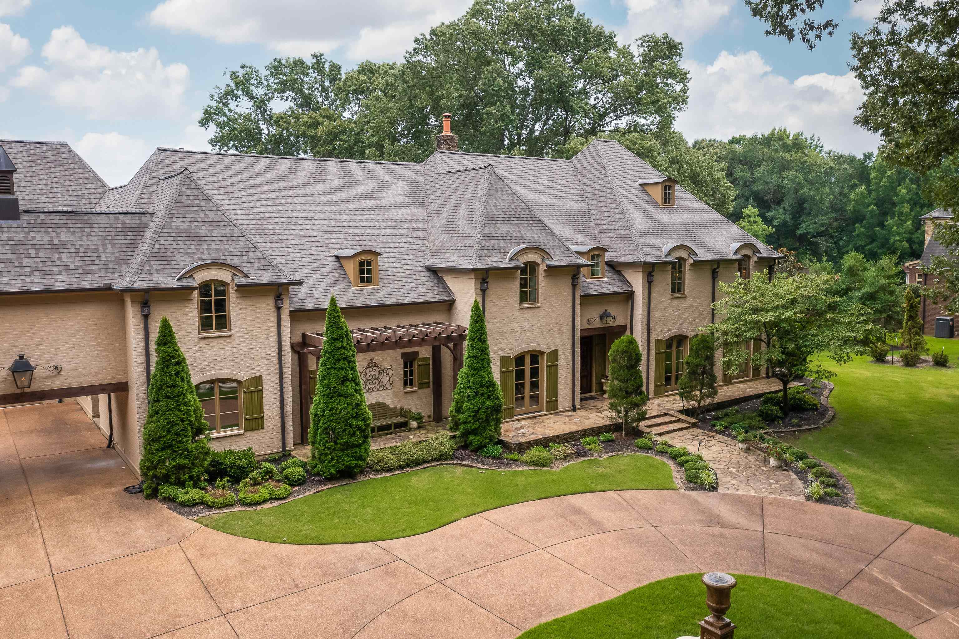 a aerial view of a house with a yard