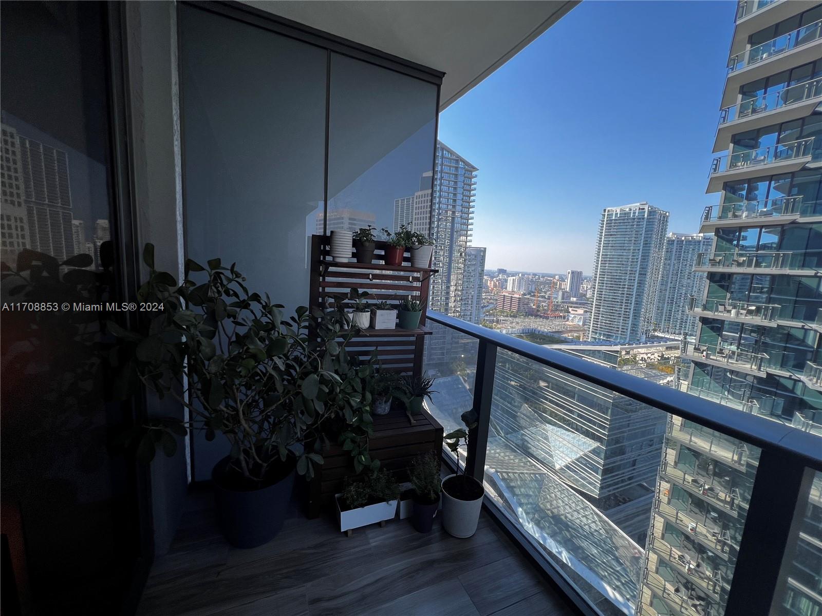 a view of balcony with furniture