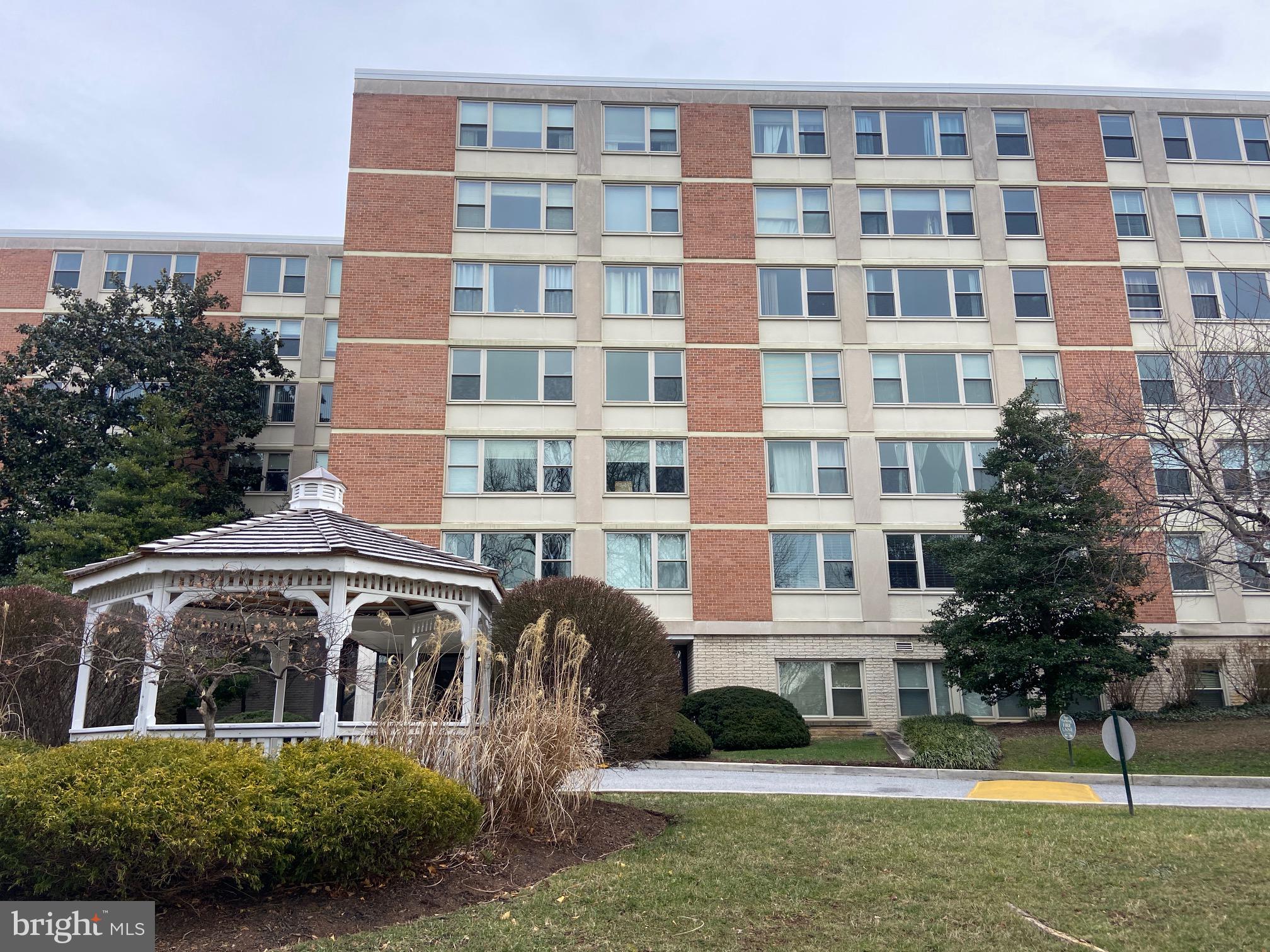 a front view of a building with garden