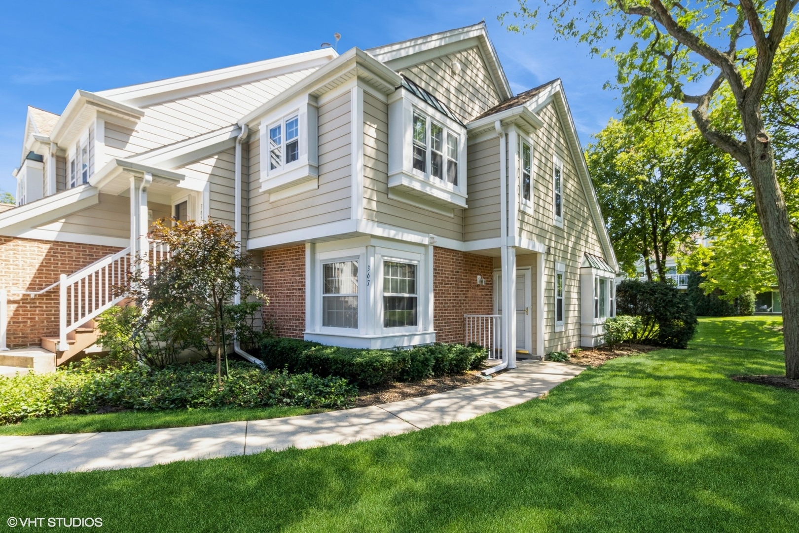 a front view of a house with a yard