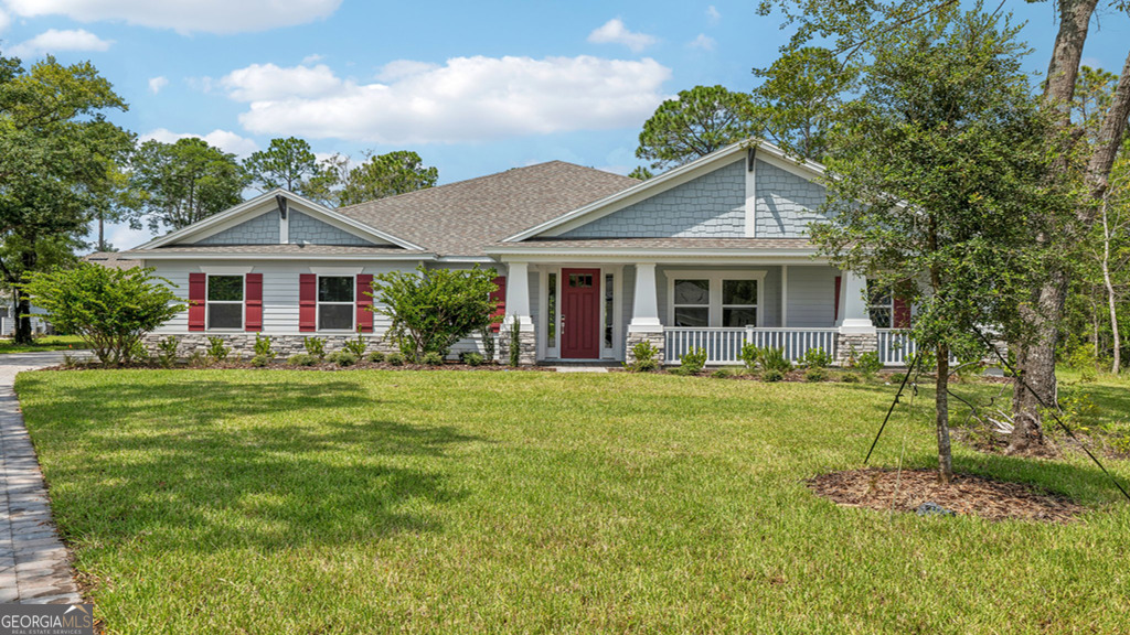 a front view of house with yard and green space