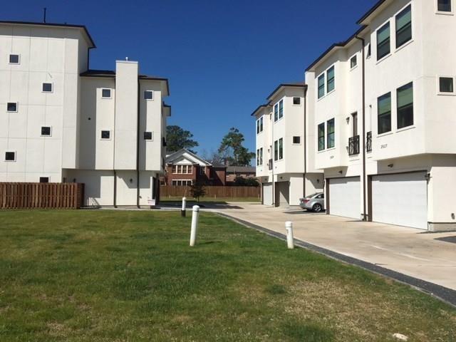 a view of building with yard