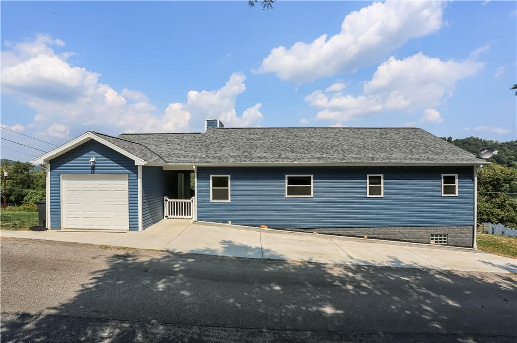 a front view of a house with yard