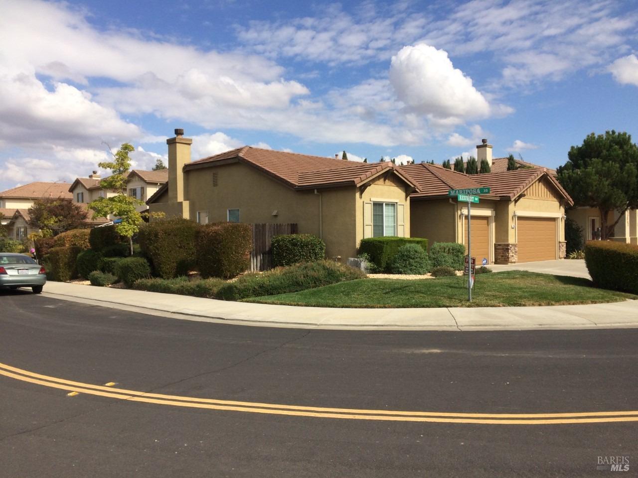 front view of a house with a street