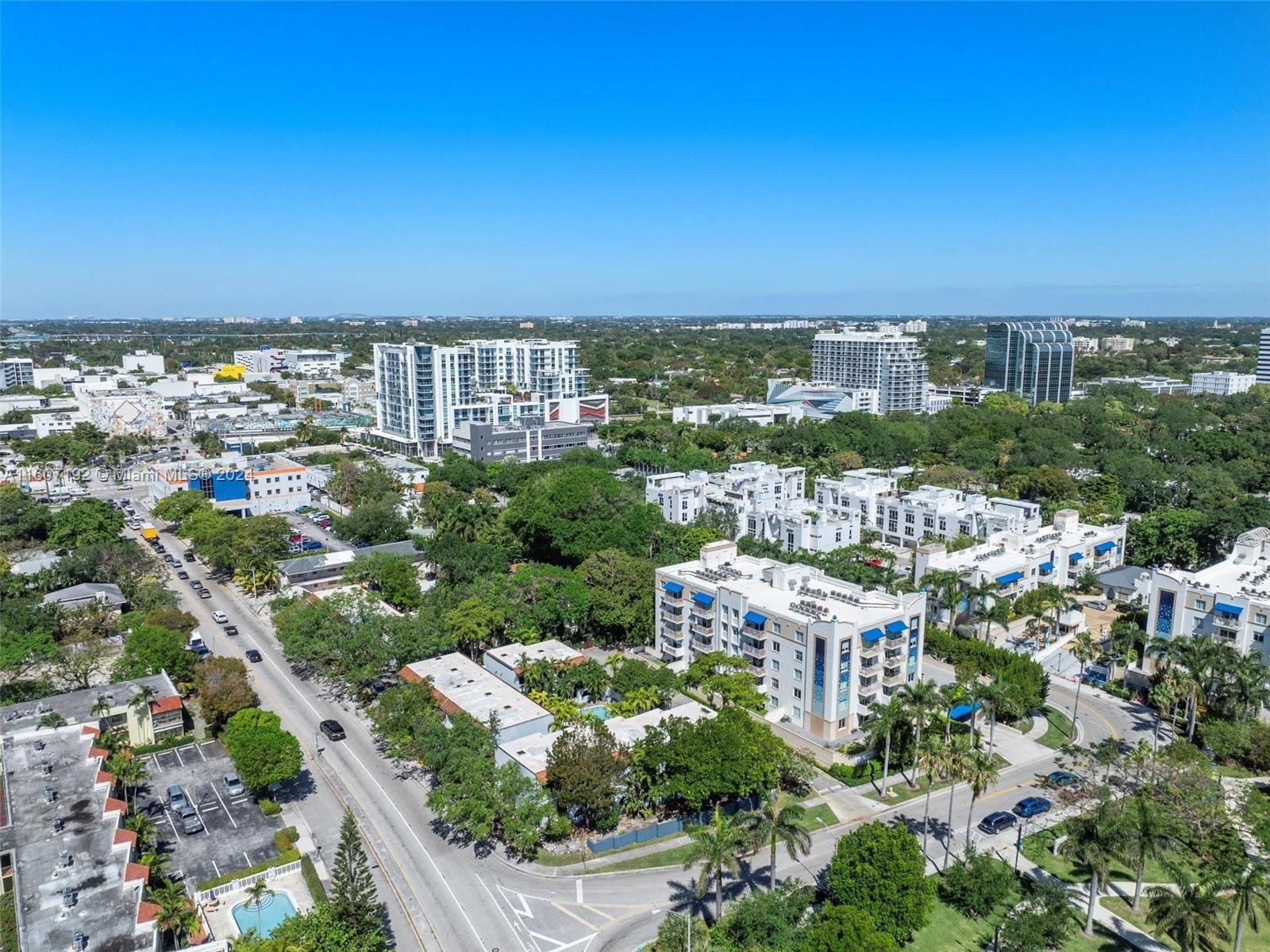 an aerial view of multiple house with yard