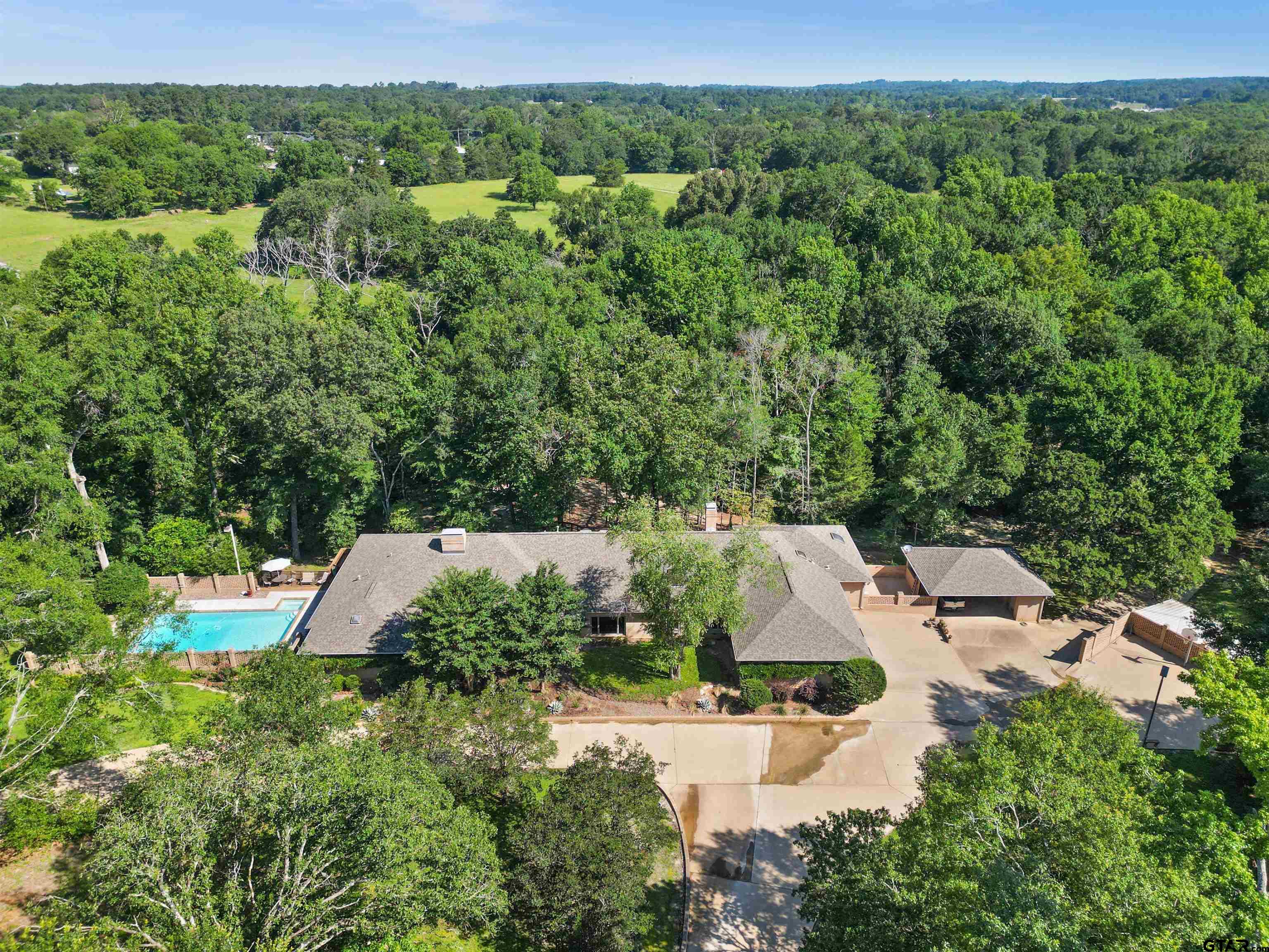 an aerial view of residential house with outdoor space