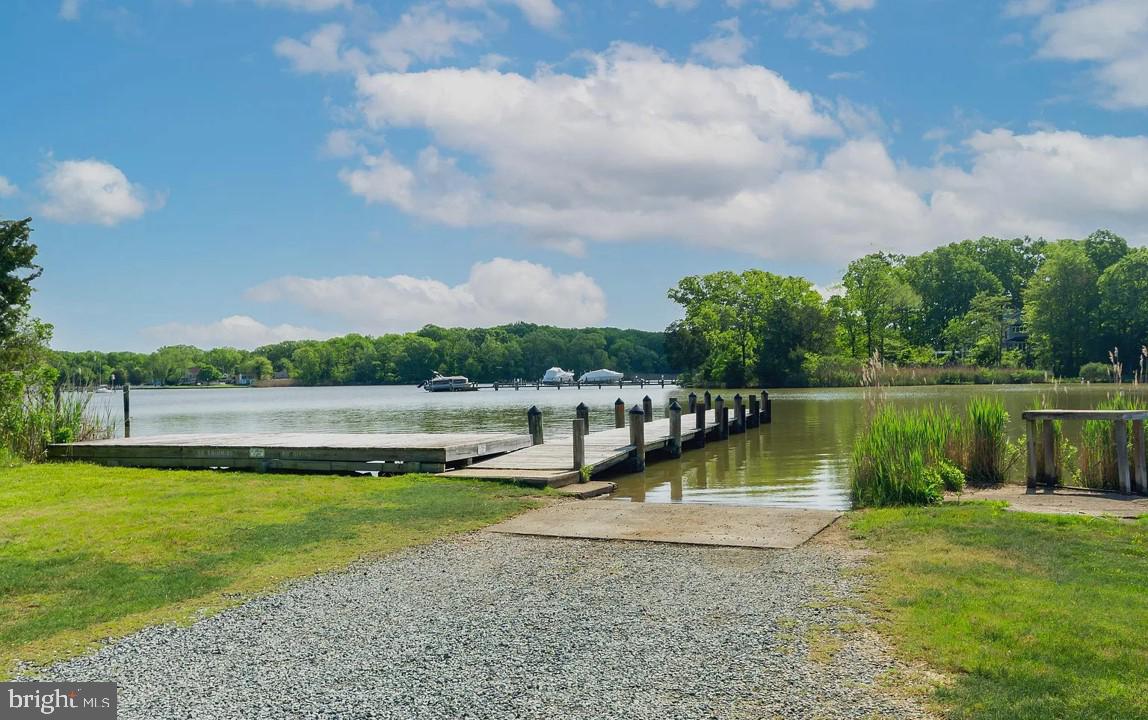 a view of a lake with houses in the back