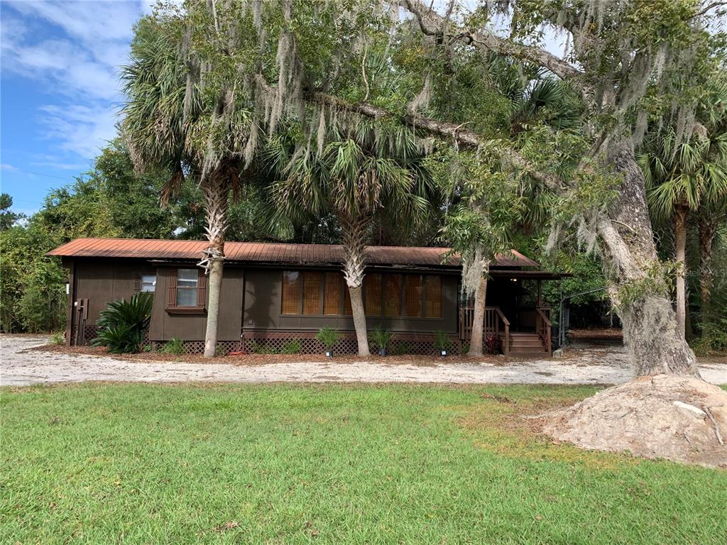 a house with trees in front of it