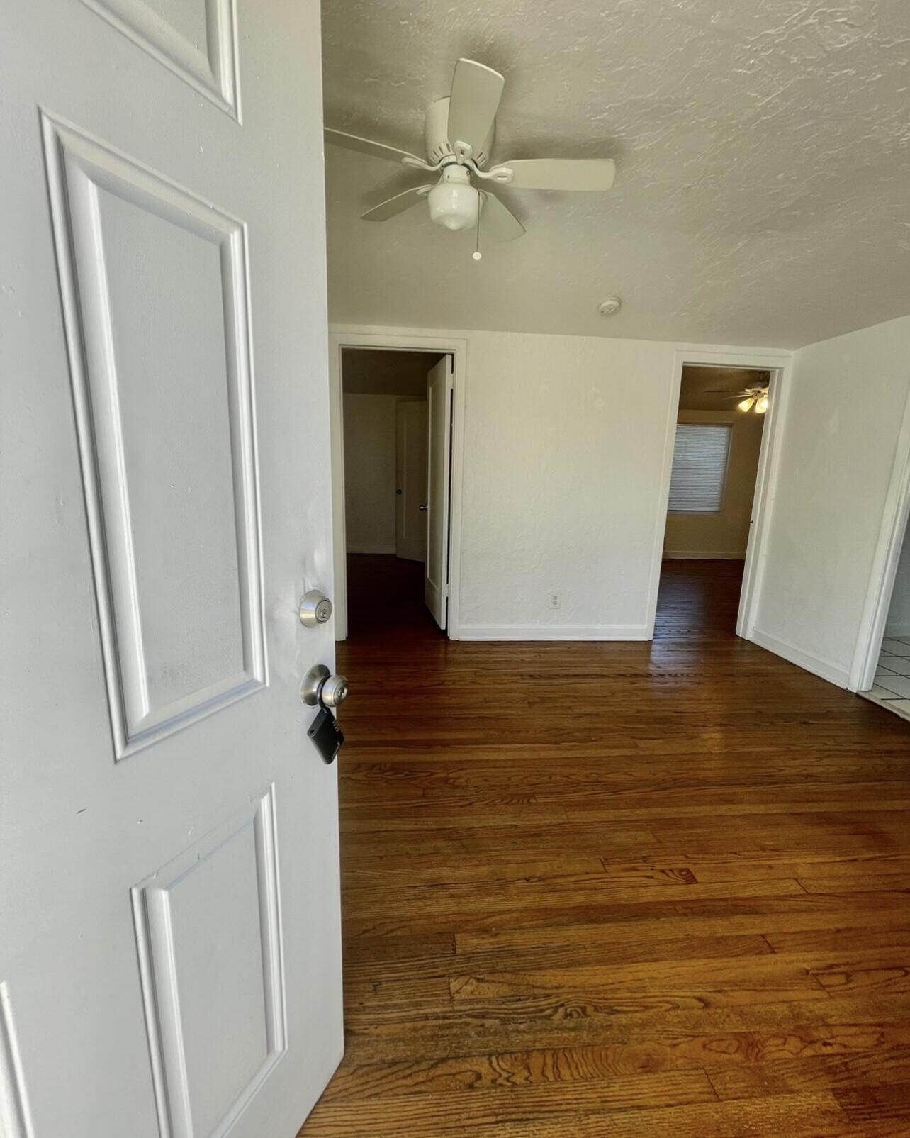 a view of an empty room with a bathroom