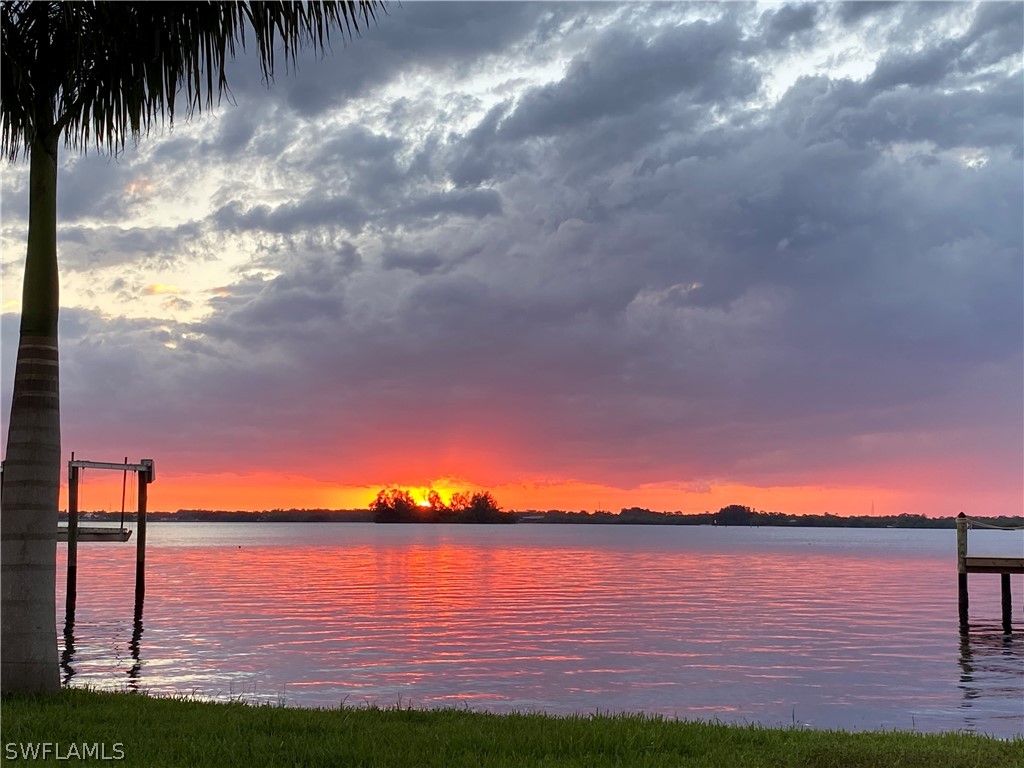 a view of lake with green space