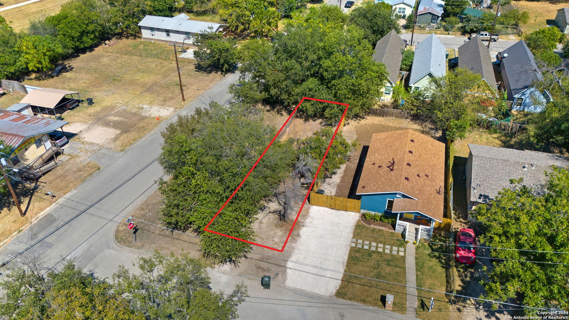 an aerial view of a house with a yard