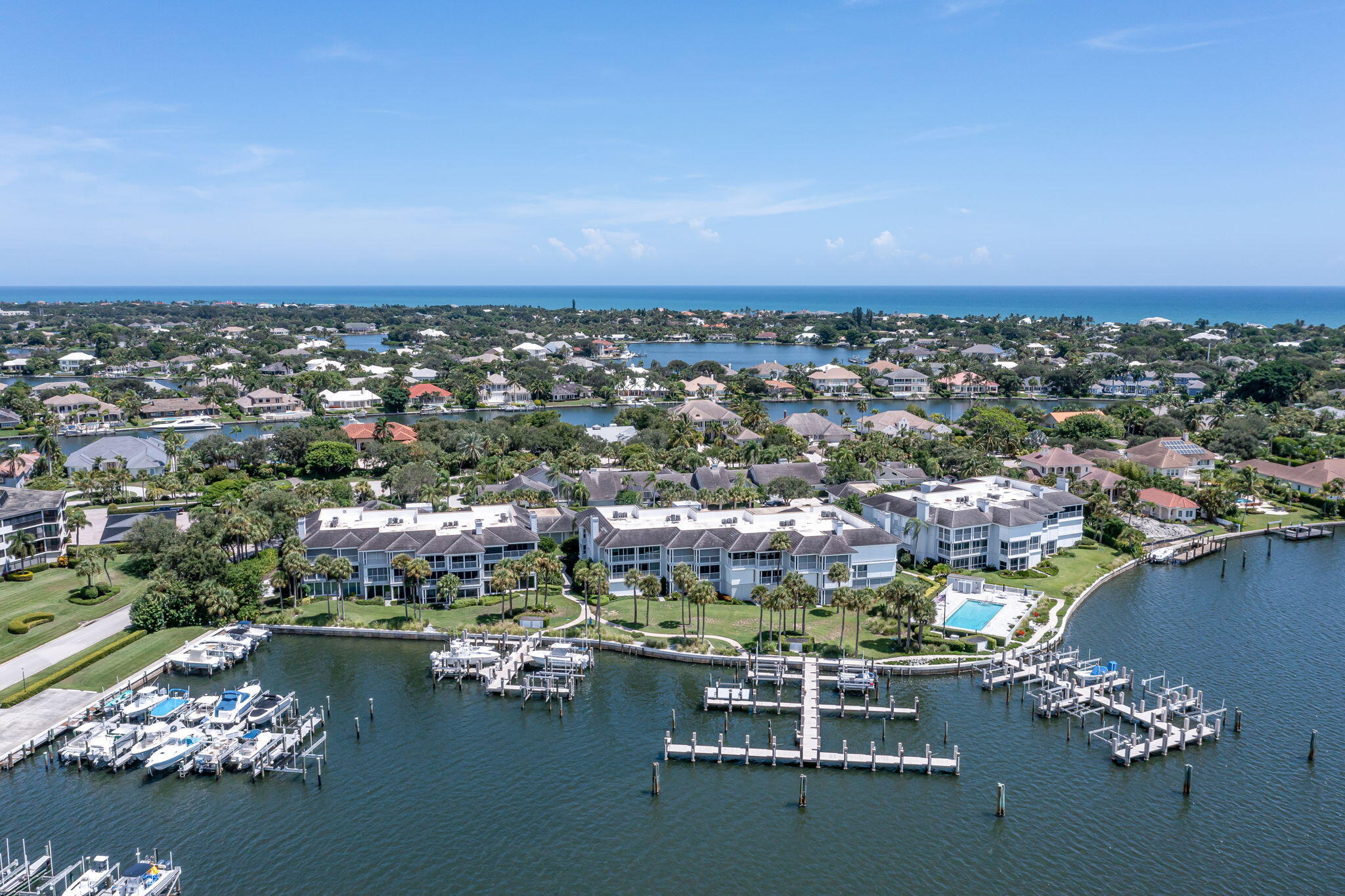 an aerial view of a city with ocean view