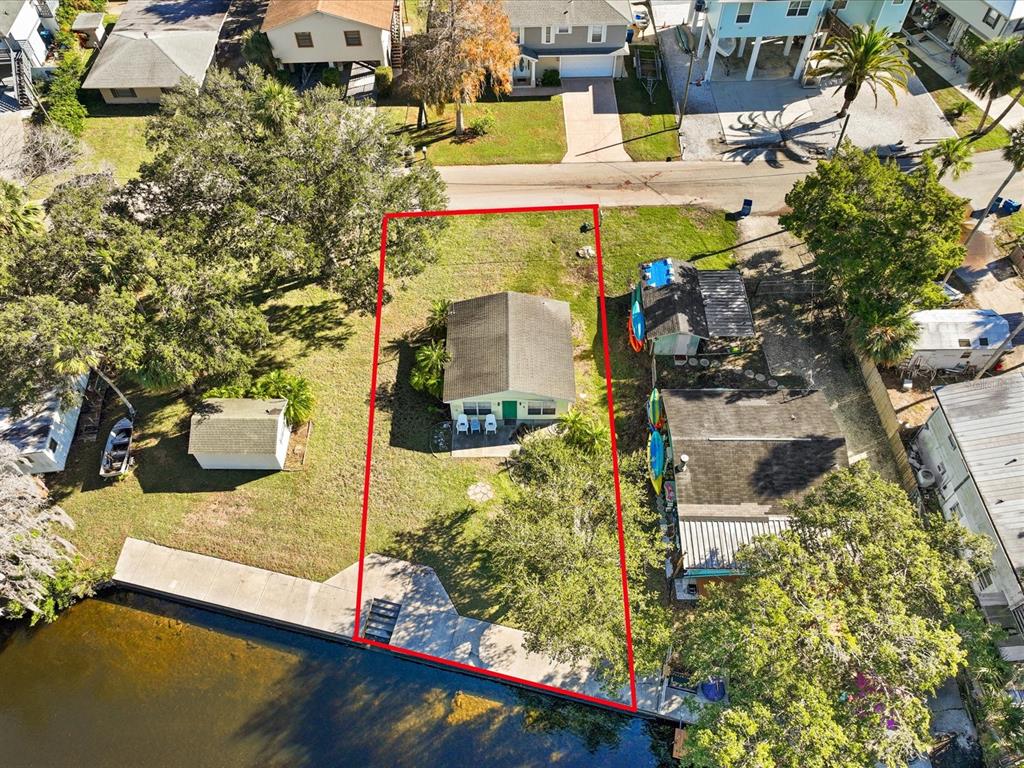 an aerial view of a house with outdoor space