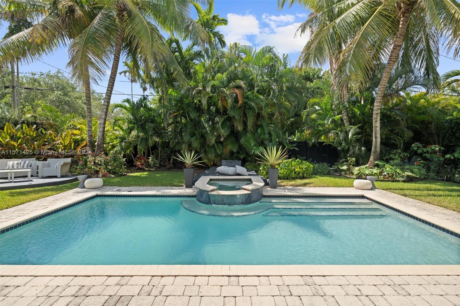 a view of a swimming pool with a lawn chairs