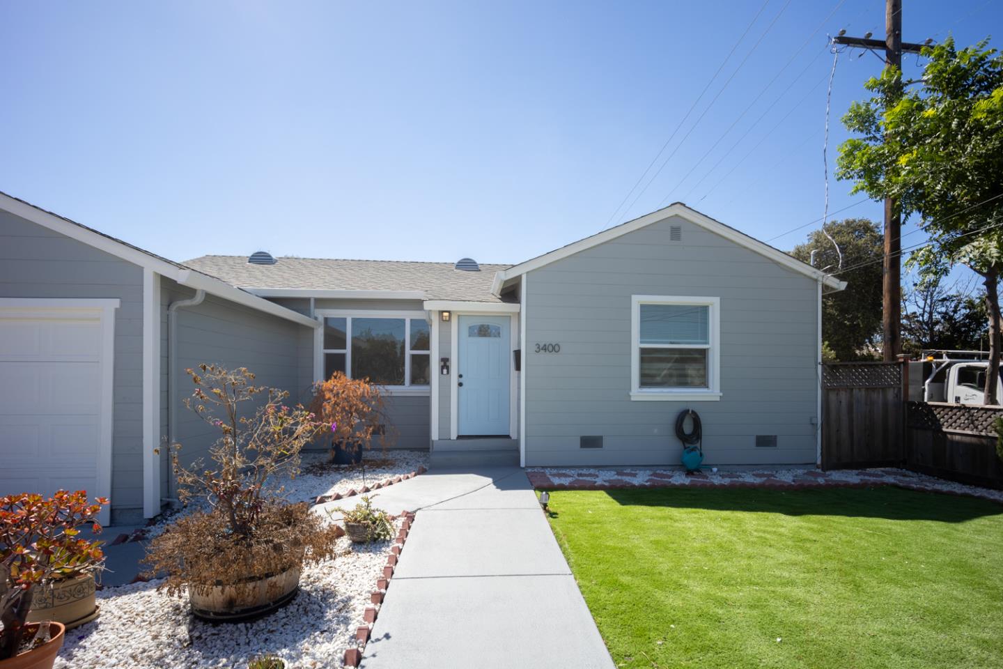 a front view of house with yard and outdoor seating