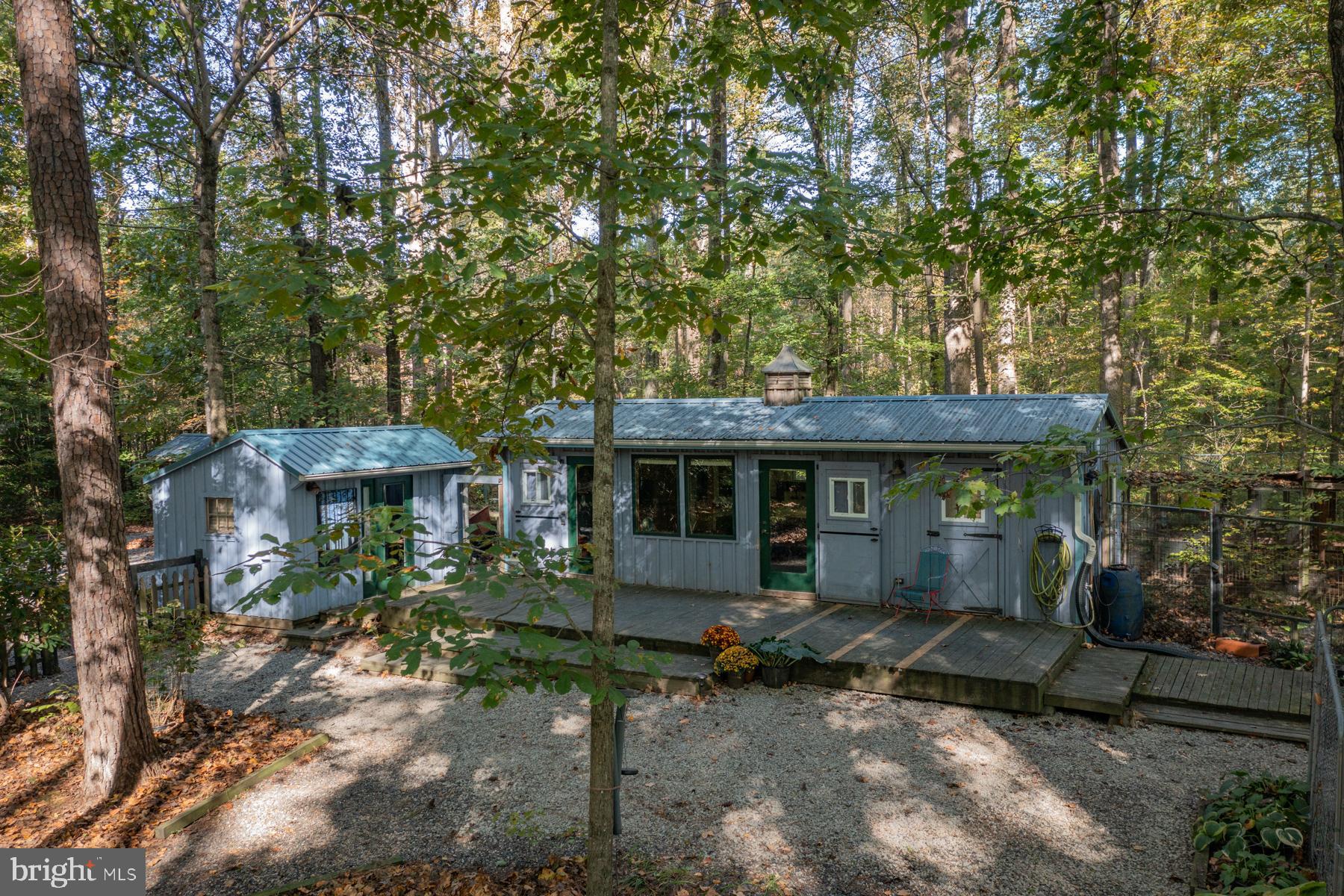 a backyard of a house with yard barbeque oven and outdoor seating