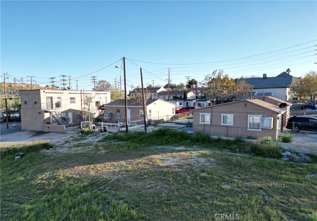 a view of a house with a backyard and a garden