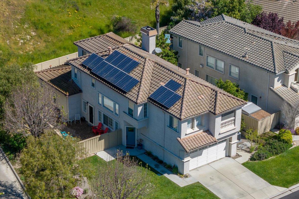 a aerial view of a house with a yard